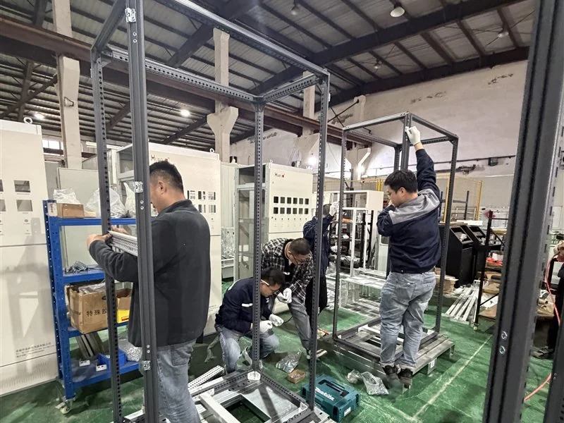 Workshop team assembling a modular cabinet frame